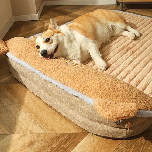 un chien allongé dans un lit pour chien orthopédique moelleux avec appui-tête intégré, confortable pour un sommeil réparateur, soulageant articulations et muscles fatigués