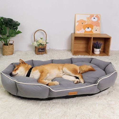 Lit pour chien gris moelleux avec rebords surélevés, idéal pour petits et grands chiens, design élégant et confortable.