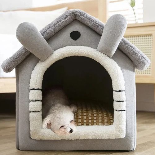 Niche d'intérieur pour chien fermée et sécurisante, couleur gris, offrant confort et chaleur à un petit chien.