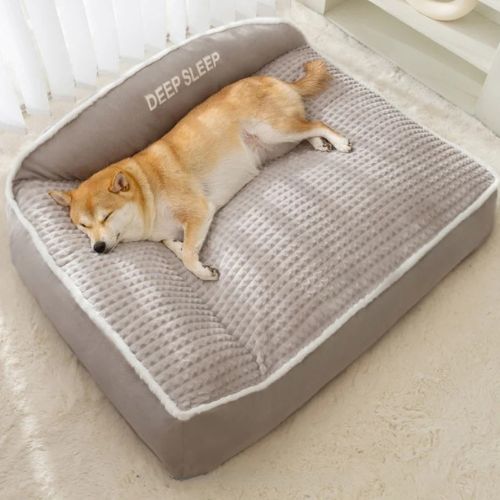 Lit pour chien moelleux gris avec coussin épais et rebord, idéal pour sommeil réparateur