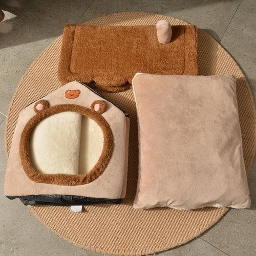Niche d’intérieur pour chien, démonté, plié et posé au sol pour le rangement ou l'entretien.